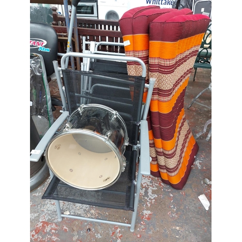 276 - Eight items to include a set of six grey metal folding patio chairs with black upholstery, a black M... 