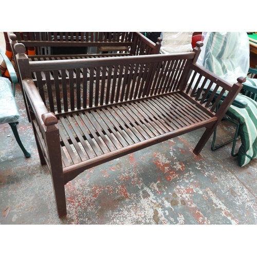 292 - An early 20th century English wooden slatted three seat garden bench