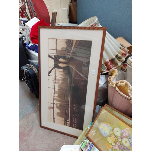 300 - A very large mixed clearance lot to include pictures, glassware, lampshades, clothing, suitcases etc... 