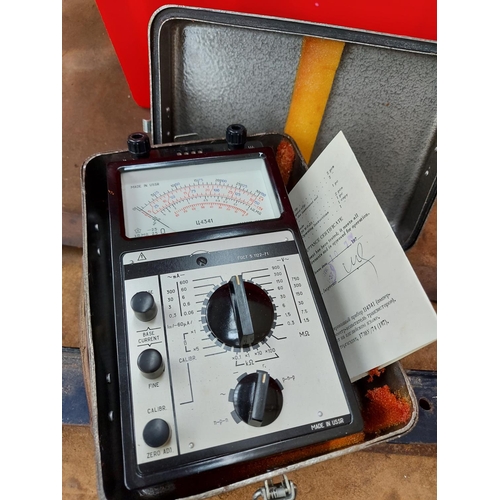 309 - Two boxes containing small gardening hand tools, twin cylinder foot pump, metal cased avometer and t... 