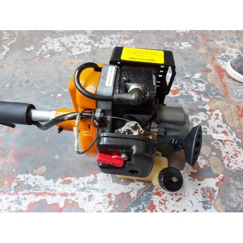 322 - A black and orange McCulloch T2030 petrol strimmer