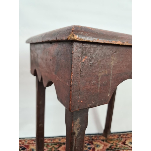 234 - An 18th century stained pine four legged tall farmhouse stool with central handle to top - measuring... 