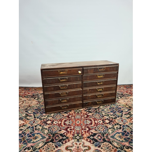 235 - An early 20th century oak twelve drawer index cabinet with brass handles - measuring approx. 78cm in... 