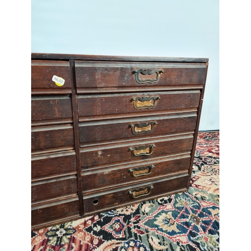 235 - An early 20th century oak twelve drawer index cabinet with brass handles - measuring approx. 78cm in... 