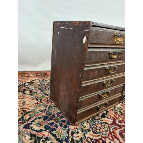 235 - An early 20th century oak twelve drawer index cabinet with brass handles - measuring approx. 78cm in... 