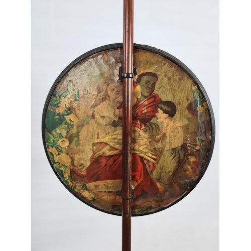 236 - A Victorian mahogany adjustable fire screen with circular guard with scrap book collage scenes and t... 