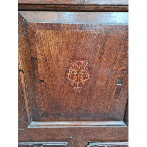 237 - A Georgian inlaid oak mule chest with two lower drawers, brass regency handles and bone estucheon