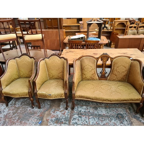 238 - An Edwardian inlaid mahogany framed parlour suite comprising two seat sofa with central oval fretwor... 