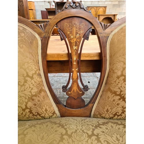 238 - An Edwardian inlaid mahogany framed parlour suite comprising two seat sofa with central oval fretwor... 