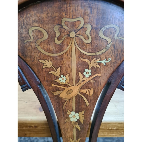 238 - An Edwardian inlaid mahogany framed parlour suite comprising two seat sofa with central oval fretwor... 