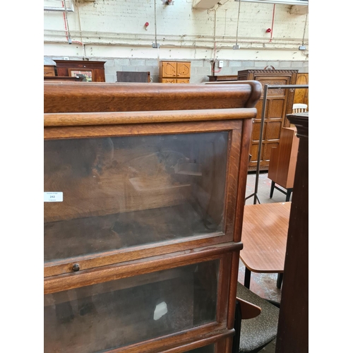 242 - An early 20th century oak Globe-Wernicke style four tier stacking bookcase with three glazed doors a... 