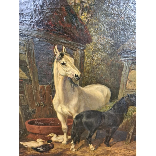 251 - A 19th century unsigned and frameless oil on canvas of horses at stable scene - measuring approx. 61... 
