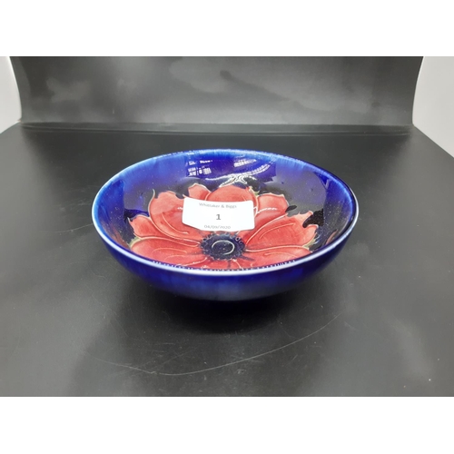 1 - A Moorcroft pottery small bowl in the anemone pattern on blue ground - measuring approx. 11.5cm in d... 