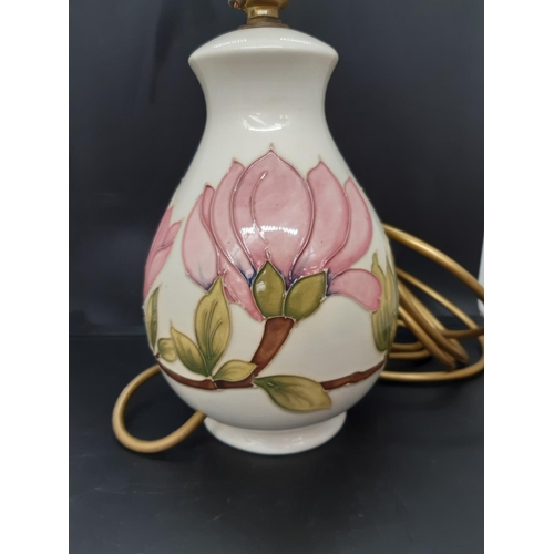 4 - A Moorcroft pottery table lamp in the pink magnolia pattern on cream ground - measuring approx. 26cm... 