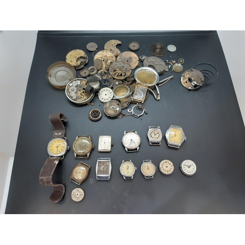 56 - A collection of watch parts and accessories to include 1940’s ‘Misalla’ gents wrist watch with brown... 