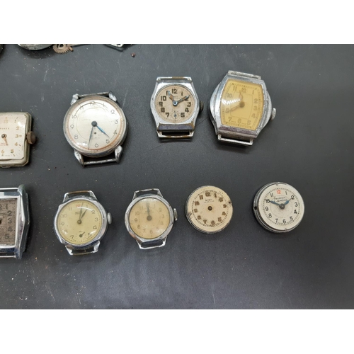 56 - A collection of watch parts and accessories to include 1940’s ‘Misalla’ gents wrist watch with brown... 