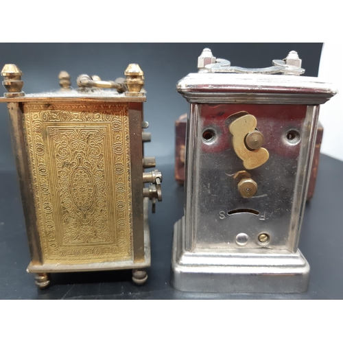 58 - Two vintage travel clocks to include a brass cased ‘LSM’ and a leather cased miniature carriage cloc... 