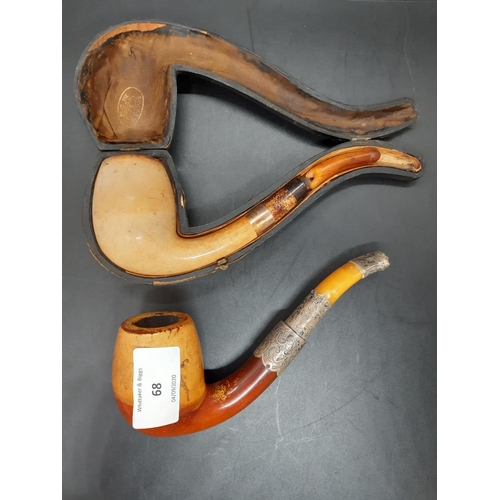 68 - Two antique pipes to include a black leather cased example with hallmarked 9ct gold collar and amber... 