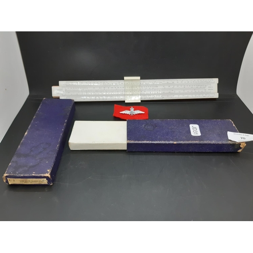 70 - Two items to include a cased ‘unique’ universal II slide rule and a modern RAF brooch