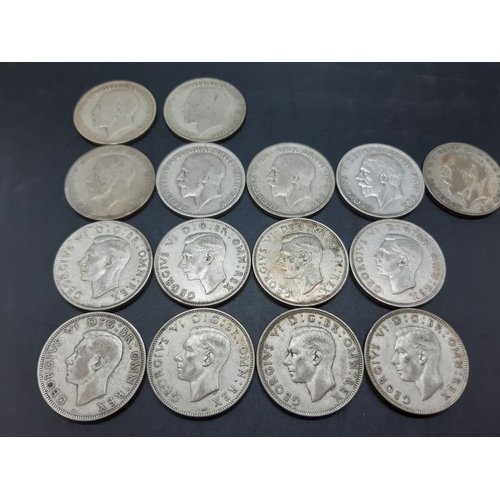 74 - A collection of various mid 20th century .500 grade silver coins to include a 1930 Florin, 1933 shil... 