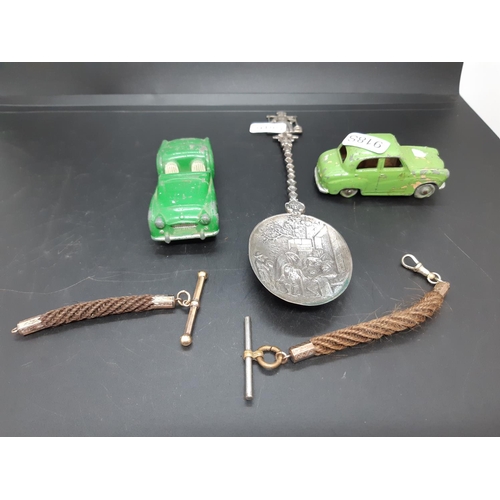 75 - A box containing various items to include a white metal apostle spoon, Dinky Austin A30 car, Corgi T... 