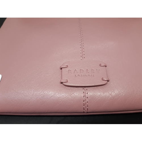 81 - An as new ladies ‘Radley London’ pink leather shoulder / hand bag