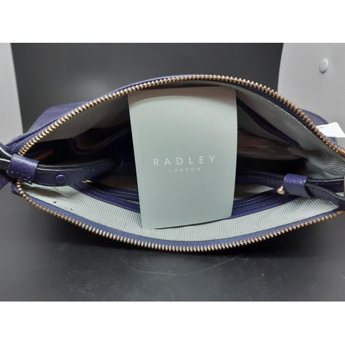 82 - A ladies ‘Radley London’ purple leather shoulder / hand bag