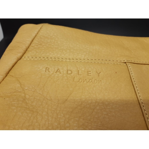 84 - A ladies ‘Radley London’ yellow leather shoulder / hand bag