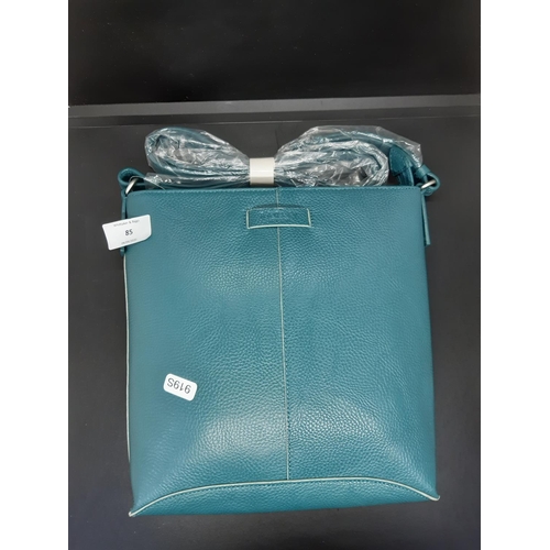 85 - An as new ladies ‘Radley London’ green leather shoulder bag - complete with dust cover and original ... 