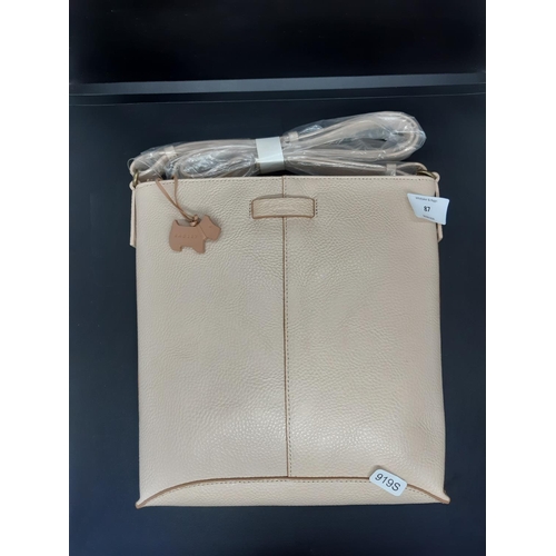 87 - An as new ladies ‘Radley London’ cream leather shoulder / hand bag - complete with original dust cov... 