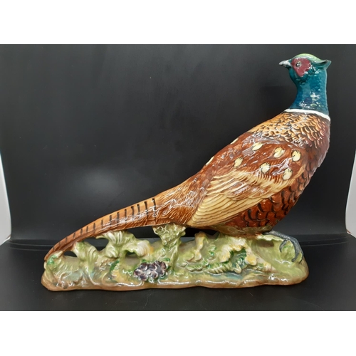 9 - A Beswick pheasant figurine - No. 1225 (Approx. 20cm tall and 25.5cm wide)