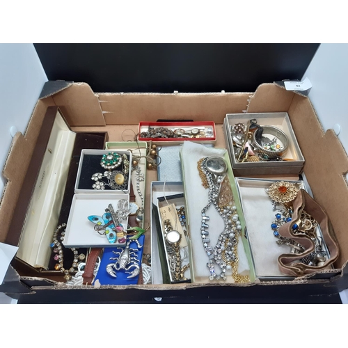 92 - A box containing a large collection of costume jewellery and watches to include an Art Deco hallmark... 