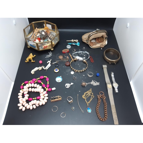 95 - A box containing a collection of costume jewellery to include necklaces, a Bentima star ladies cockt... 