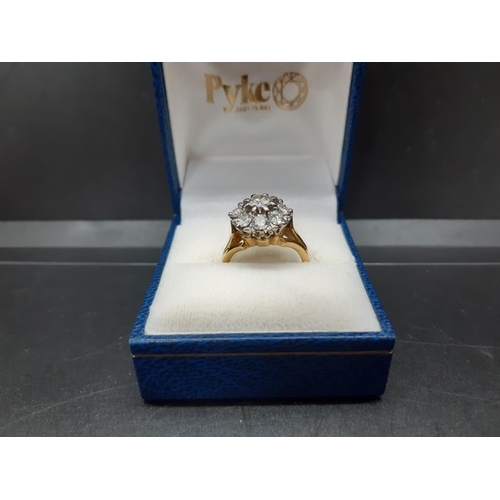 96 - An excellent quality ladies hallmarked 18ct yellow gold, 1.38ct diamond cluster ring with nine inset... 