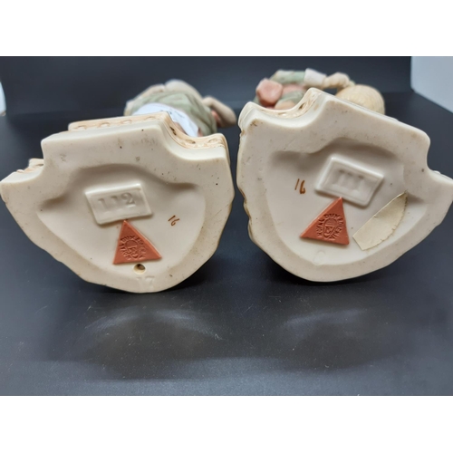 10 - A pair of early/mid 20th century Royal Dux figurines of young boy and girl flower sellers with trian... 