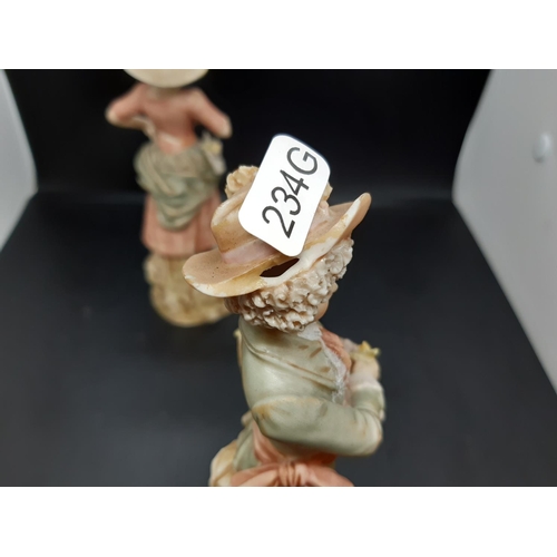 10 - A pair of early/mid 20th century Royal Dux figurines of young boy and girl flower sellers with trian... 