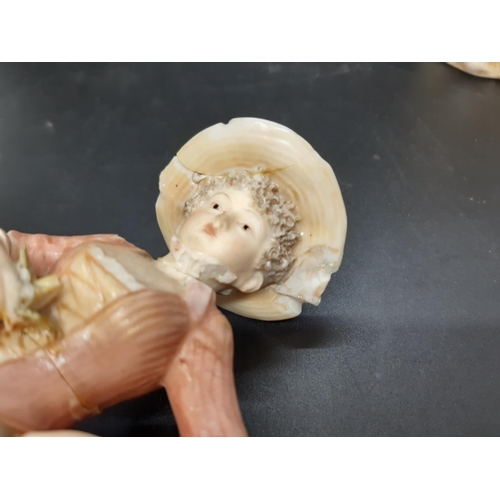 10 - A pair of early/mid 20th century Royal Dux figurines of young boy and girl flower sellers with trian... 