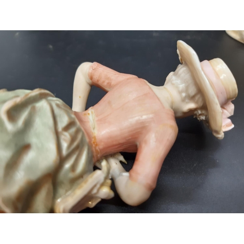 10 - A pair of early/mid 20th century Royal Dux figurines of young boy and girl flower sellers with trian... 