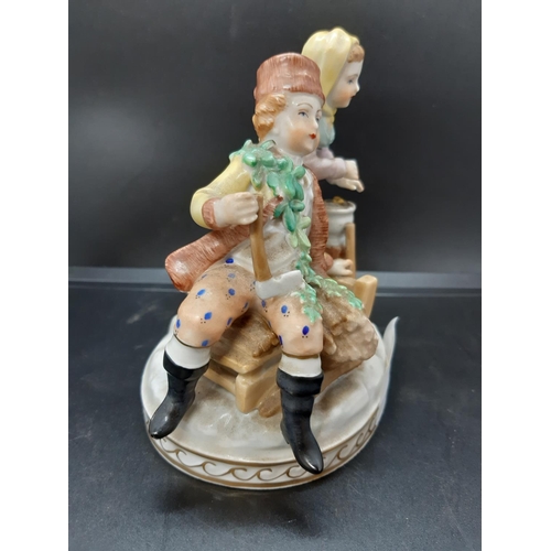 11 - An early 20th century blue brand Dresden four seasons figurine - model no. 7107