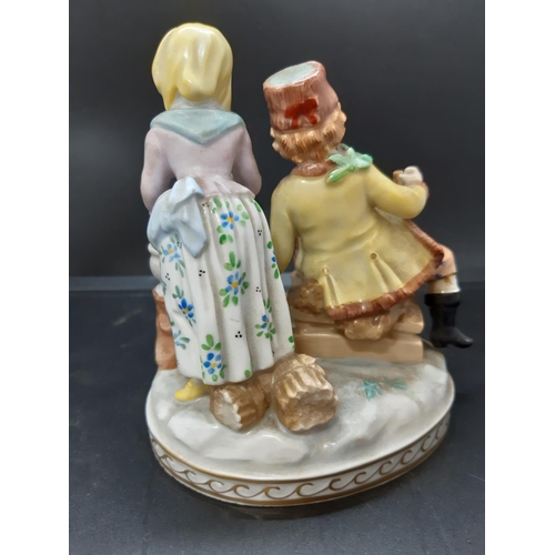 11 - An early 20th century blue brand Dresden four seasons figurine - model no. 7107