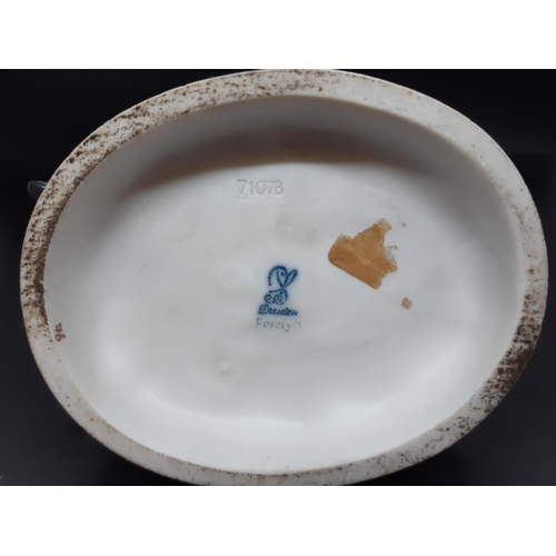 11 - An early 20th century blue brand Dresden four seasons figurine - model no. 7107