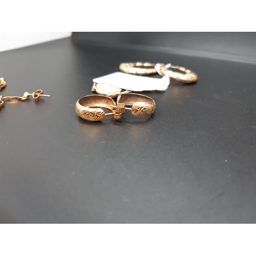 117 - A collection of hallmarked 9ct gold jewellery comprising a large pair of earrings with etched design... 