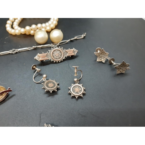 119 - A Collection of vintage and antique jewellery comprising simulated pearl necklace, bearded gentleman... 