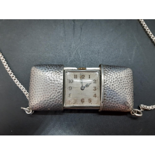 121 - A circa 1929 Movado Ermeto hallmarked 935 grade hammered silver concealed pocket purse watch with ha... 