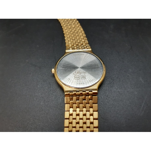 123 - A gents Longines Quartz Flagship 7292 wristwatch with white dial, gold tone hourly batons, the date ... 