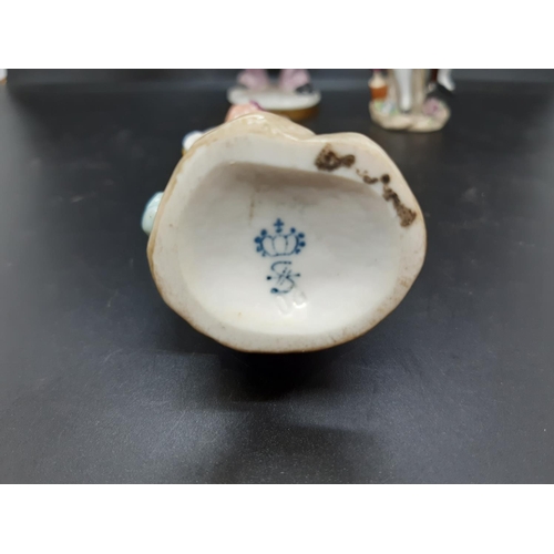 17 - A group of four continental porcelain figurines to include Sandizell Hoffner & Co 1950's Rococo styl... 