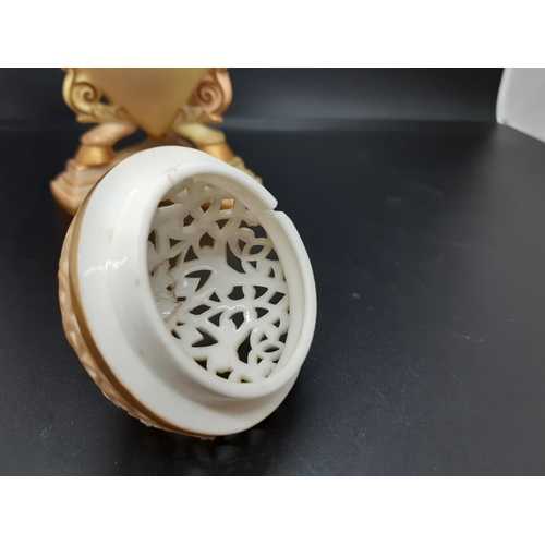 2 - A 19th century Royal China Works Grainger & Co. blush ivory pot pourri on tri footed base