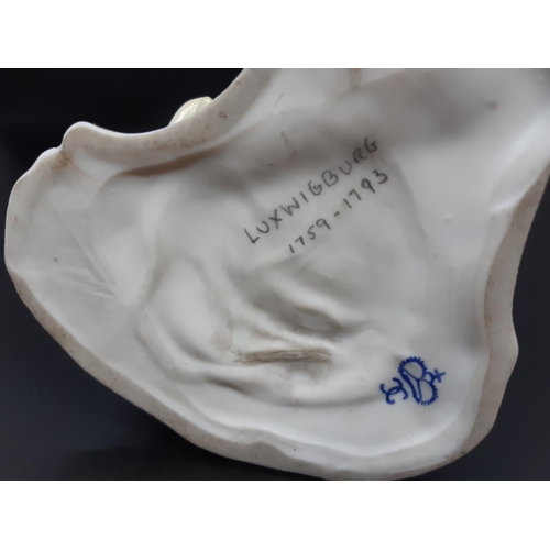 22 - A mid 20th century Ludwigsburg porcelain figurine of a dog attacking lady in dress with 