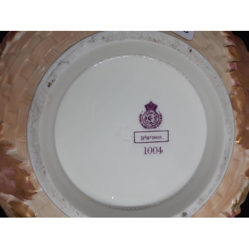 26 - A large Royal Worcester centre bowl decorated with basket weave design, large open pierced scalloped... 