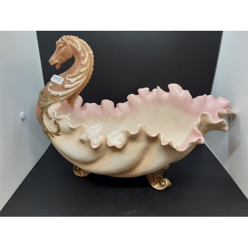 27 - An impressive 19th century porcelain centre bowl with scalloped edge, horse head front, tri-footed b... 